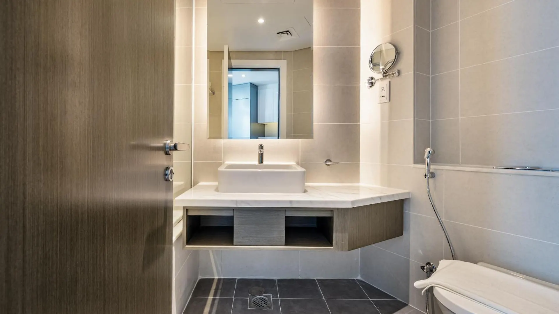 A Living Stylish Studio Apartment With Partial Burj & Canal View At Prive B 1417 Дубай ОАЭ