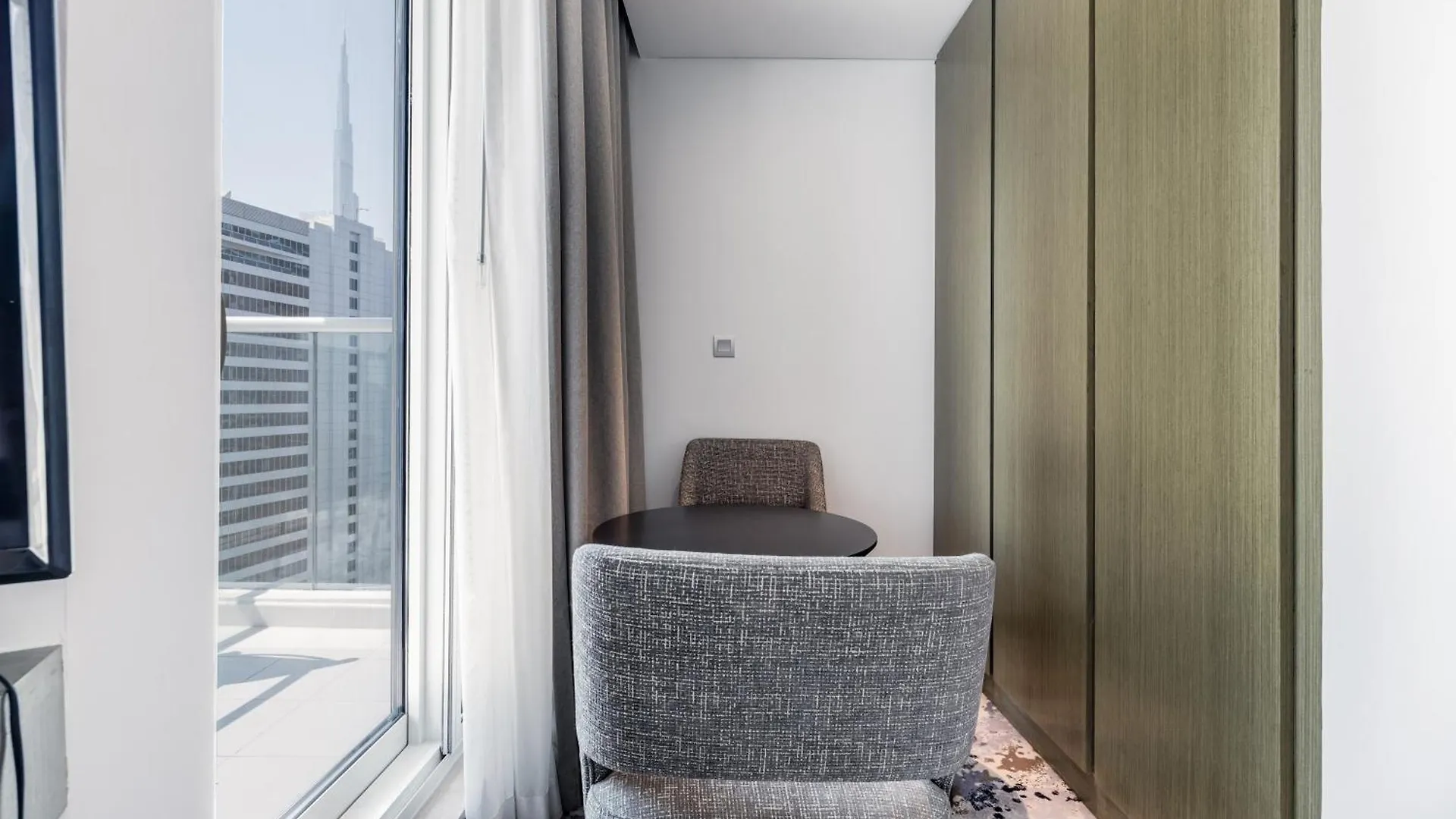 A Living Stylish Studio Apartment With Partial Burj & Canal View At Prive B 1417 Дубай